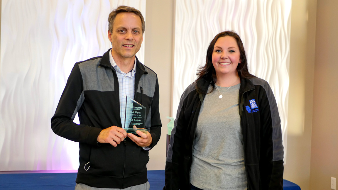Youth program mentor accepts award